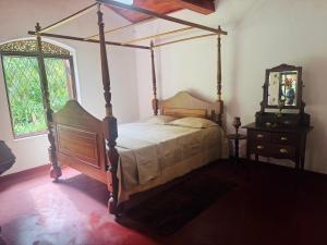 Ένα ή περισσότερα κρεβάτια σε δωμάτιο στο Galagoda Mansion