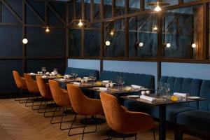 a dining room with a long table and chairs at NH Alicante in Alicante
