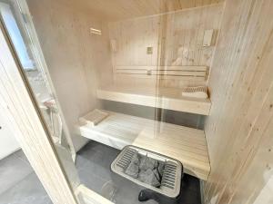 a small sauna with a bench in a room at Chalet magnifique à Valloire avec vue sur montagne. in Valloire +44 photos