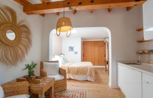 a living room with a bed and a kitchen at Can Aisha in Es Pujols +60 photos