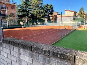 a tennis court with a net on a court at Roma Chic Flat Gemelli in Rome