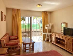 A television and/or entertainment centre at Charming Studio in Costa del Silencio, 45 m², Near Pool