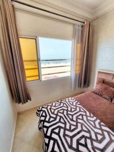 Ένα ή περισσότερα κρεβάτια σε δωμάτιο στο Cozy apartment in Agadir 80 m² with sea view