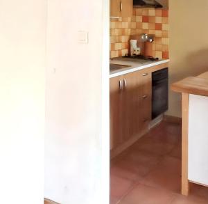a kitchen with a sink and a stove at Appartement confortable à Hyères avec terrasse in Hyères +6 photos