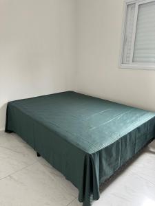 Ένα ή περισσότερα κρεβάτια σε δωμάτιο στο 4- Casa 7 pessoas - Guilhermina, Churrasqueira +18 φωτογραφίες
