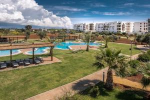 an aerial view of a resort with a swimming pool at North Cyprus Thalassa beach resort in Paralimni +4 photos