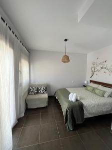 A bed or beds in a room at Mirador del Río