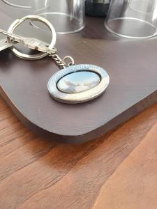 a key chain with a picture of a fish on it at Spacious Apartment in Espinho with Fireplace, 87 sqm in Espinho