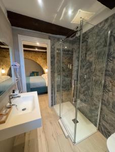 a bathroom with a shower and a sink at Arco di Pietra B&B in Crotone +36 photos