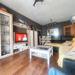 A television and/or entertainment centre at Spacious apartment with mountain view in Tabernas, 99 sqm