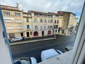 a view from a window of a street with buildings at L'Ibéris - Toutes les commodités dans la rue - 1er étage in Auch