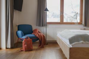 Postel nebo postele na pokoji v ubytování biYou Ecoquartier in den Bergen