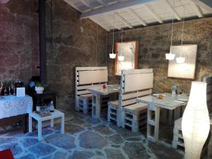 Een restaurant of ander eetgelegenheid bij Casas da Quinta da Cancela