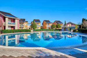 Bazén v ubytování Jesolo Village Beach House - Host Solution nebo v jeho okolí