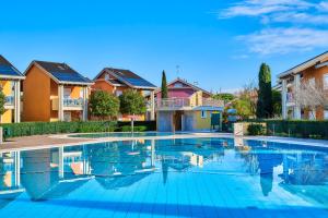 Bazén v ubytování Jesolo Village Beach House - Host Solution nebo v jeho okolí