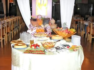 a table with a buffet of food on it at Comfortable Bungalow Near Pataias with Shared Pool in Pataias
