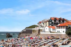 a beach with a lot of umbrellas and the ocean at Charming Bungalow in Pataias with Shared Pool in Pataias +15 photos
