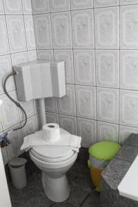 a bathroom with a toilet with two rolls of toilet paper at VILA SOFi in Néa Karyá +34 photos