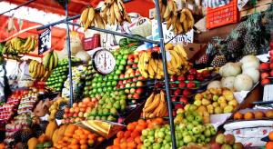 a display of fruits and vegetables in a market at Maison charmante Deshaie + Vue in Deshaies +4 photos