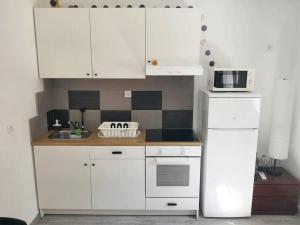 Kuchyň nebo kuchyňský kout v ubytování Cosy Apartment in Villaviciosa de Odón with Shared Pool
