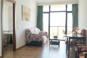 A seating area at Comfortable apartment in Benalmádena 60 m² with pool