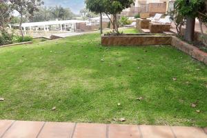 A garden outside Comfortable apartment in Benalmádena 60 m² with pool