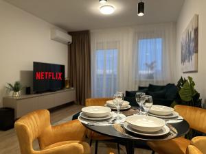 a dining room with a table with plates and wine glasses at Nuppu1, free parking, self check-in in Trnávka