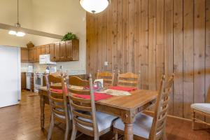 a dining room with a wooden table and chairs at Causeway 3026 in Pagosa Springs
