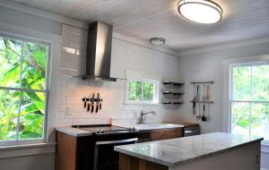a kitchen with a sink and a counter top at Renovated Lemon Guesthouse 4 KING Bedrooms Downtown Half Mile Stroll- Beach Only 3 Miles in Saint Augustine +44 photos