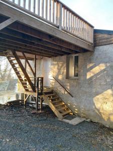 a stairway leading up to a house at Les Terrasses Perchées sur l'Oudon Segré in Saint-Vincent +9 photos