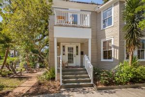 a home with a staircase leading to the front door at Historic Lady Renovated-Half Mile Walk to DT-Beach 3 Mi-Optional Guesthouse in Saint Augustine