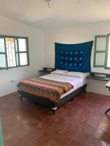 Ένα ή περισσότερα κρεβάτια σε δωμάτιο στο Viento Este Guest House