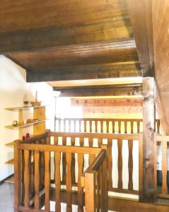 a wooden staircase in a room with a wooden ceiling at Appartement cosy à Samoëns de 57 m² avec balcon. in Samoëns +14 photos