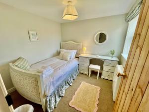 En eller flere senge i et værelse på Chantry Cottage - Newby Hall, Ripon, North Yorkshire