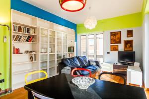 a living room with a table and a couch at Sorrento Central Flats in Sorrento