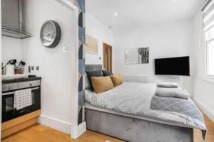 Ένα ή περισσότερα κρεβάτια σε δωμάτιο στο Brighton courtyard boutique