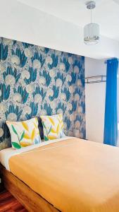 Postel nebo postele na pokoji v ubytování Appartement confortable à Raismes - 60 m², parking privé