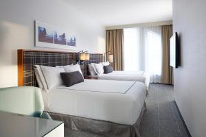 Postel nebo postele na pokoji v ubytování The Godfrey Hotel Boston + 31 fotografií