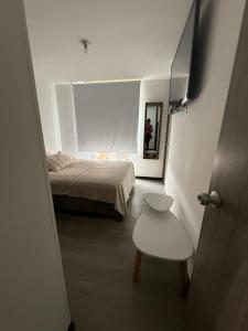 Giường trong phòng chung tại Apartamento nuevo Sotomayor dos alcobas