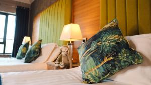 Letto o letti in una camera di Amber Springs Hotel