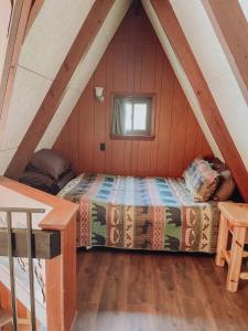 a bedroom with a bed in a attic at Edgewater Escape, Hocking Hills, Hot Tub, Pond in Rockbridge