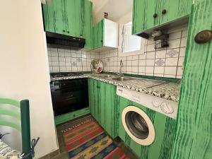 Η κουζίνα ή μικρή κουζίνα στο Villa dei Sogni - Aparthotel Ischia Ponte
