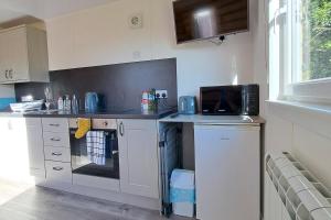 Η κουζίνα ή μικρή κουζίνα στο The Posh Bothy Spean Bridge +25 φωτογραφίες