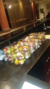 a counter with many containers of food on it at Marokkoreizen in Fès