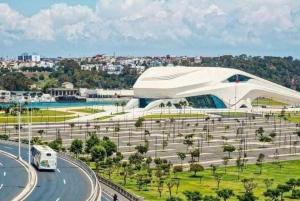 a bus driving down a road in front of a building at Marokkoreizen in Fès +37 photos