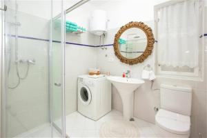 a bathroom with a toilet a sink and a shower at MY DALMATIA - Vacation house Maslenica with sea view terrace in Šarić +35 photos