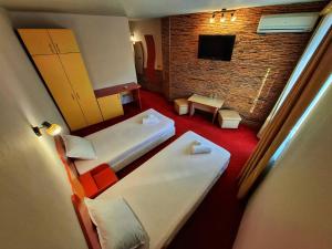 Postel nebo postele na pokoji v ubytování Korona Hotel