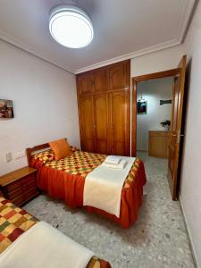 Postel nebo postele na pokoji v ubytování A.T. La Plaza