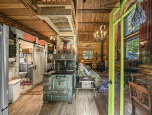 a living room with wooden walls and wood flooring at Elkhorn Lodge | Wifi, Pet Friendly, AC in Packwood