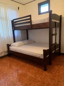 Postel nebo postele na pokoji v ubytování Villa Prada Familiar